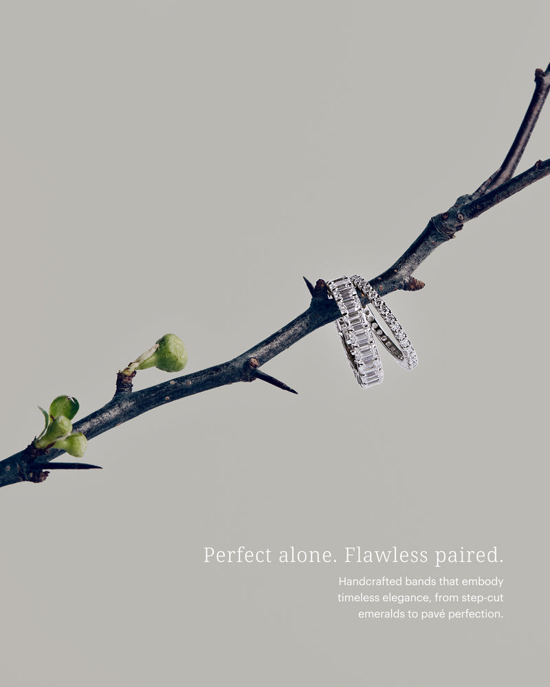 Two 14K white gold rings on a branch with a gray background and text about jewelry.