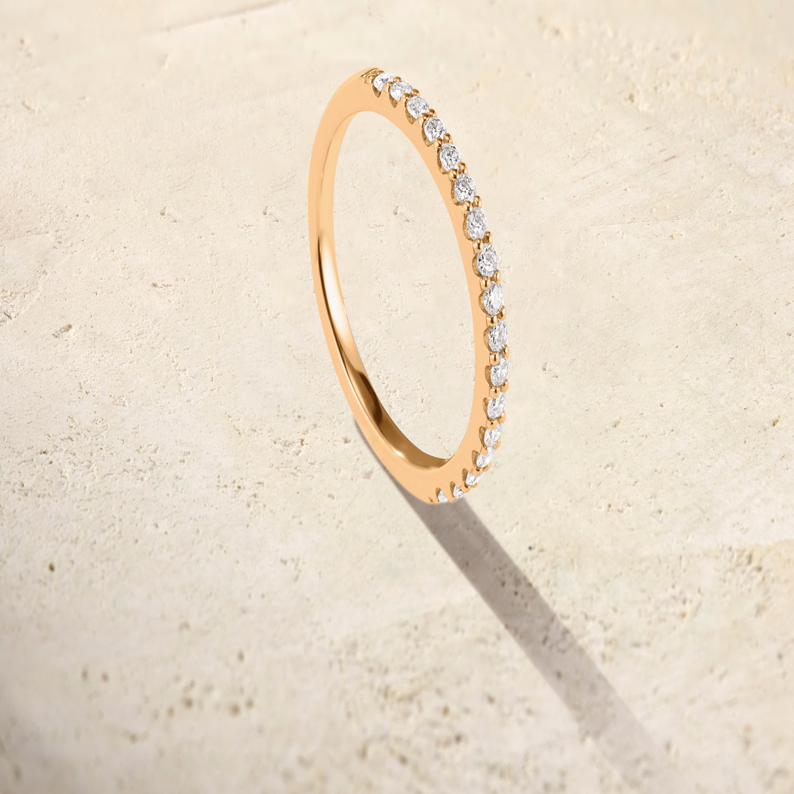 LHUNE Ciel Pavé Eternity Ring in yellow gold, 45-degree upright view of pavé diamonds on delicate slim band