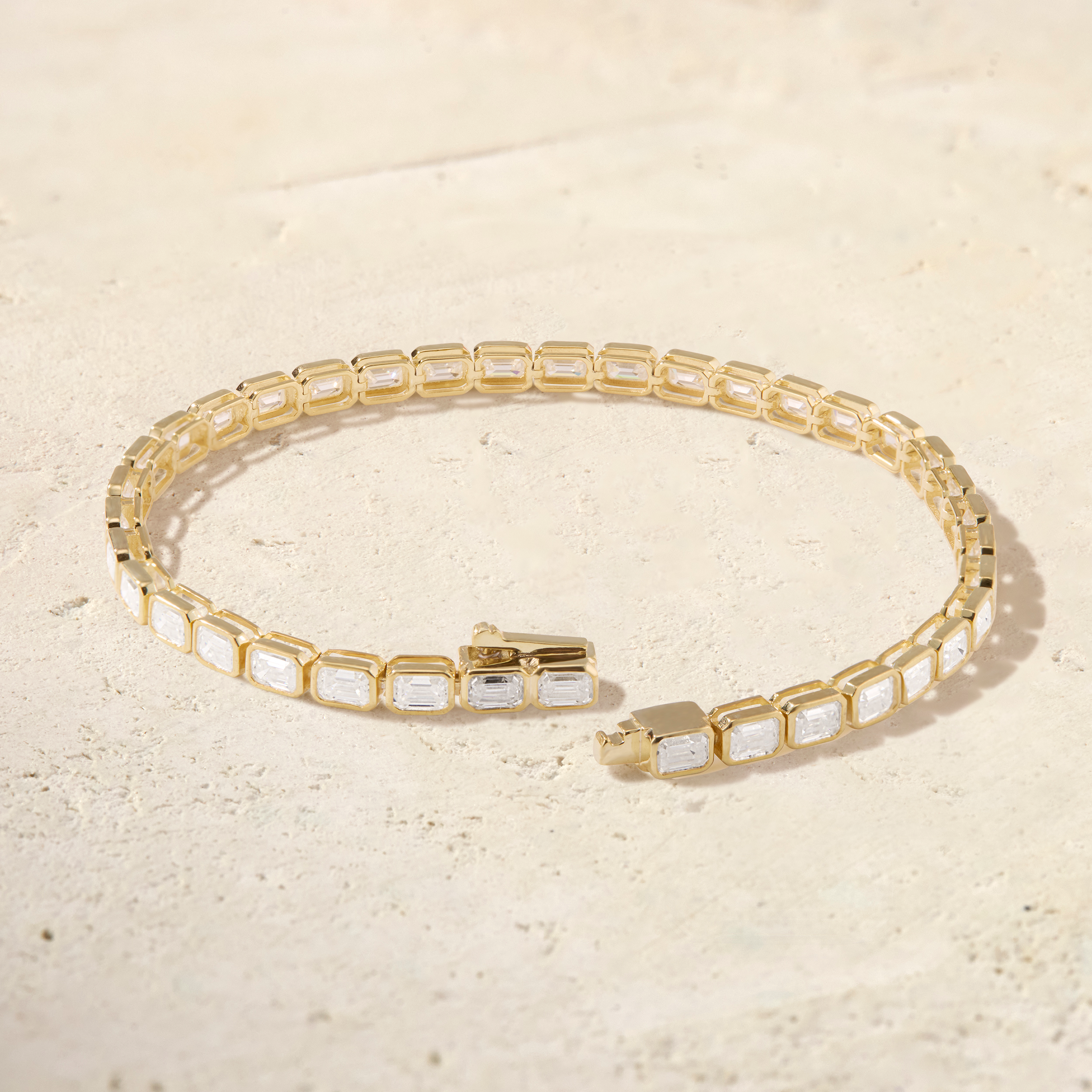LHUNE Virelle East-West Emerald-Cut Tennis Bracelet in yellow gold, open clasp detail showing LHUNE engraving