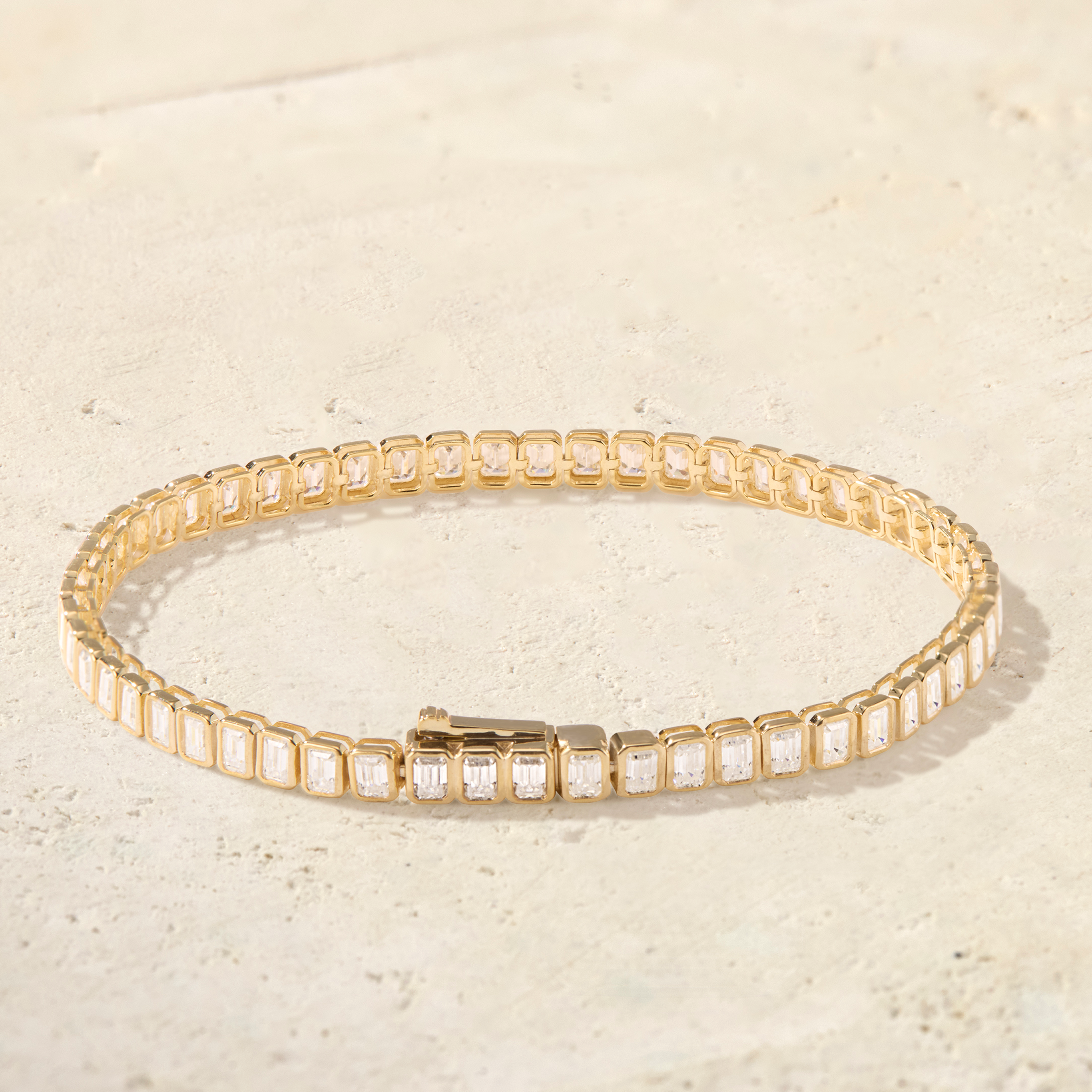 LHUNE Virelle Emerald-Cut Tennis Bracelet in yellow gold, rear view showing box clasp and bezel-set emerald-cut diamonds