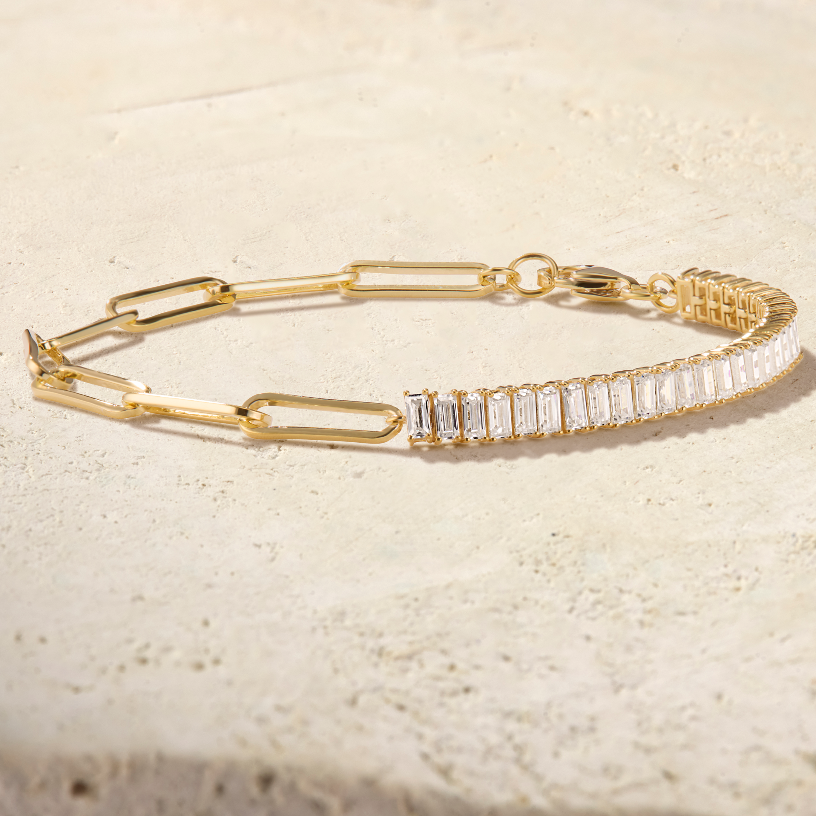 LHUNE Paperclip Baguette Tennis Bracelet in yellow gold, angled view of baguette diamond half paired with paperclip chain links